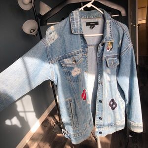 Oversized, distressed vintage denim jacket